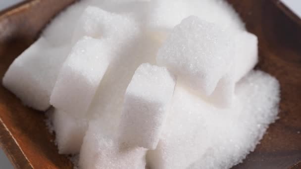 Suiker op een witte achtergrond. Een junkfood concept. Hoge kwaliteit 4k beeldmateriaal - Video