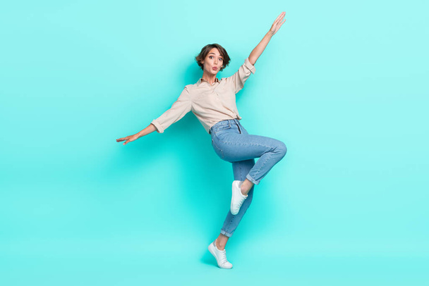 Full length photo of astonished lovely lady dressed nice clothes open arm falling down chasm empty space isolated cyan color background. - Fotó, kép