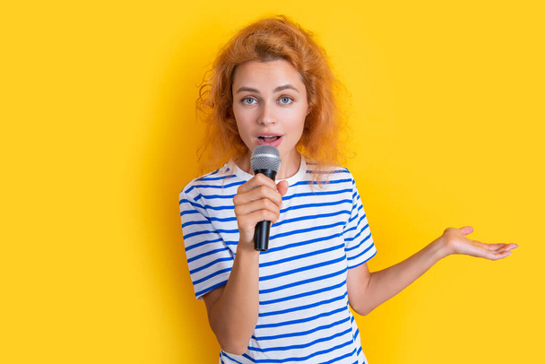 music concept. woman singer isolated on yellow background. young singer woman sing in music studio. woman singer with music microphone. - Фото, изображение