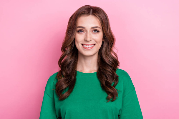 Photo of good mood optimistic woman with curly hairstyle dressed green t-shirt smiling at camera isolated on pink color background. - Foto, Bild