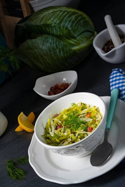 White cabbage with dill and diced bacon - 写真・画像