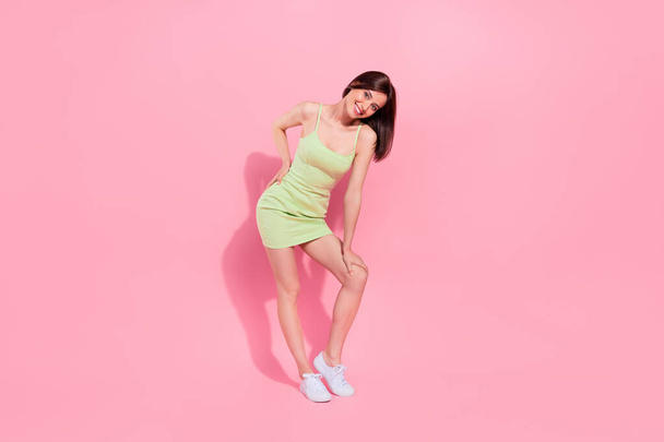 Full length photo of pretty cute young girl dressed green outfit smiling isolated pink color background. - Φωτογραφία, εικόνα