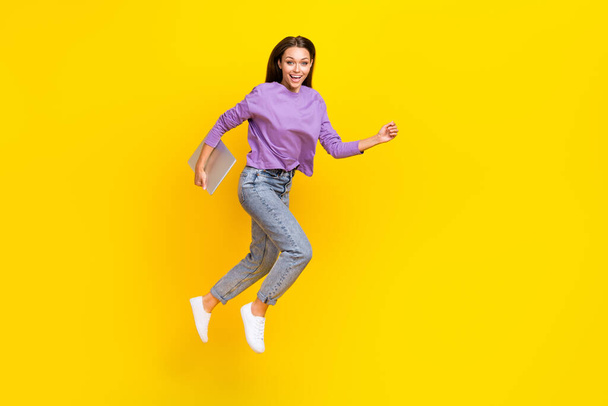 Full length photo of cheerful excited lady hold modern gadget go empty space black friday shop sale isolated on yellow color background. - Fotografie, Obrázek