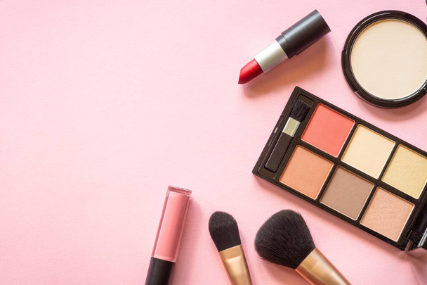 Makeup professional cosmetics on pink background. Flat lay with copy space. - Zdjęcie, obraz