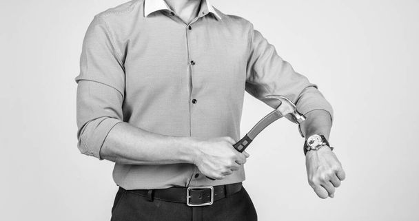 Time crunch. Businessman cropped view hammer wrist watch. Time trouble. Deadline pressure. Crash effort. Time-trouble. - Foto, imagen