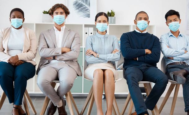 Recruitment during covid, hiring and diversity business people with mask for safety from corona virus pandemic. Portrait of group of people in waiting room for job interview with human resources hr. - Valokuva, kuva