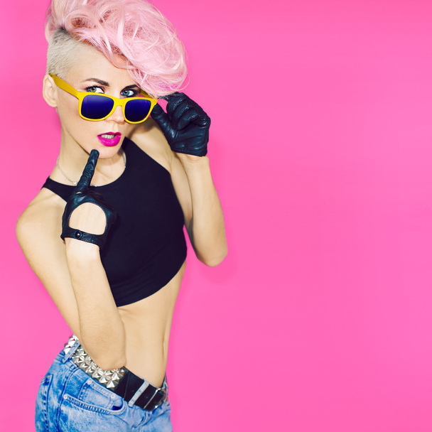 Glamorous lady punk rock style party on pink background - 写真・画像