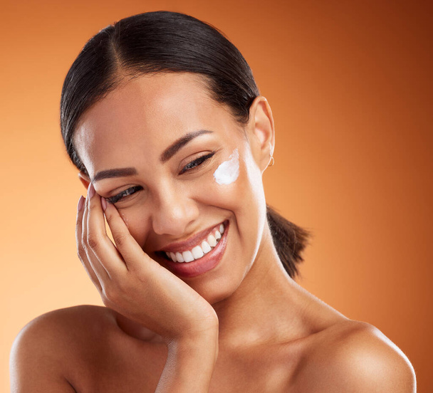 Woman, beauty and smile for skincare moisturizer, lotion or creme for soft, gentle healthcare against a studio background. Happy satisfied female in care for healthy smooth skin or cosmetic treatment. - Photo, Image