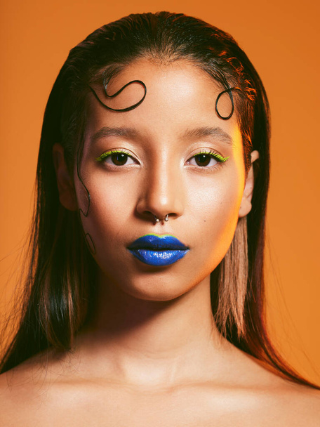 The boldest thing you can do is to do you. Studio shot of a beautiful young woman wearing blue lipstick - Фото, изображение