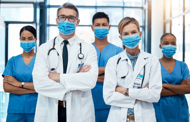 Diversity, covid and healthcare, team of doctors and nurses in hospital. Teamwork, men and women in face mask with medical success, trust and support in pandemic with help and collaboration in clinic. - 写真・画像