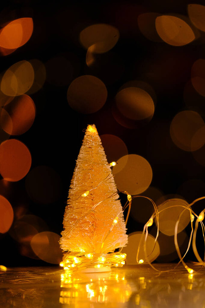 Christmas tree with shining bokeh.Christmas tree Festive bokeh background.Christmas and New Year background.Winter holidays wallpaper - Photo, Image