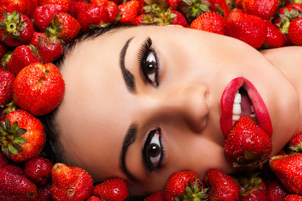 Beautiful face in strawberry - Photo, Image