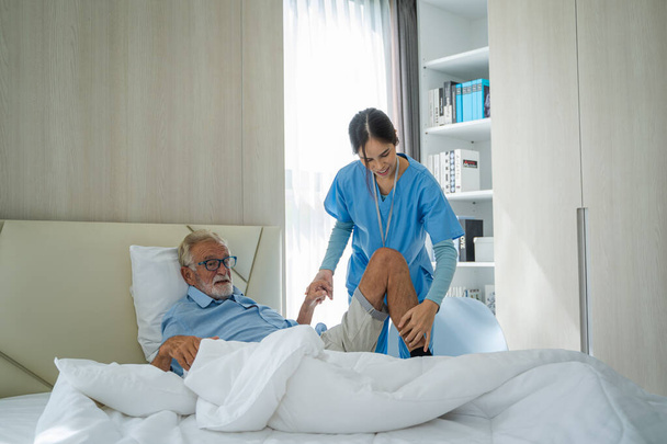 Nurses take care of senior man at home,Medical insurance service concept. - Photo, Image