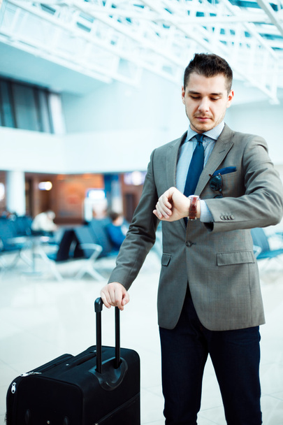 businessman checking time at airport - 写真・画像