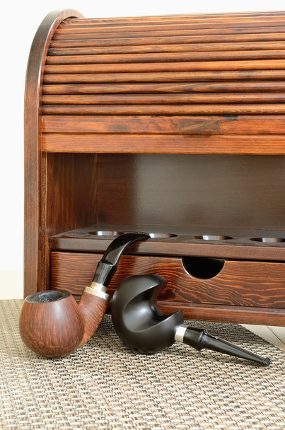 Two smoking tobacco pipes and wooden snuffbox-casket the stylish to store them - Photo, Image