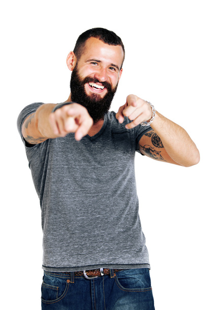 Tattooed bearded man pointing at you - 写真・画像