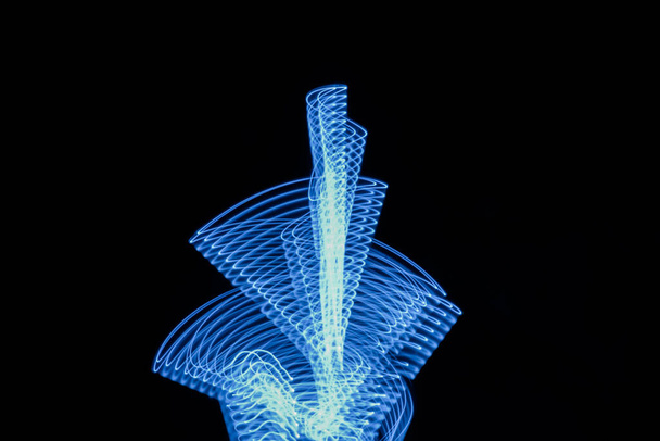 Technology digital flower neon blue light stripes on black background. High quality photo - Φωτογραφία, εικόνα