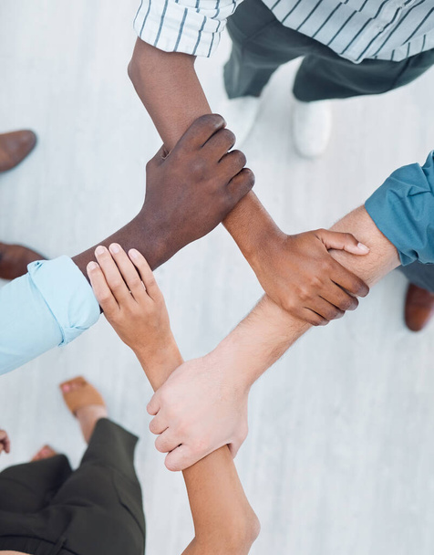 Diversity, support and teamwork with hands of business people holding arms for community, global networking or mindset goals. Vision, innovation and workshop with employee for mission, growth or hope. - Foto, Imagen