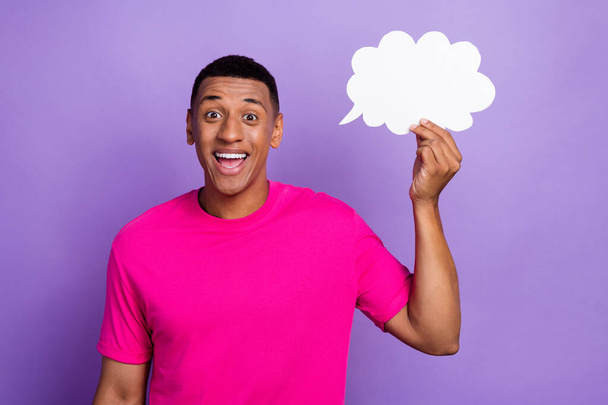 Portrait of charming positive handsome student man has genius solution his financial problems hold paper sky intellectual isolated on purple color background. - Foto, immagini