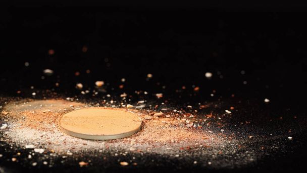 Close up view of crushed face powder on black background  - Foto, immagini