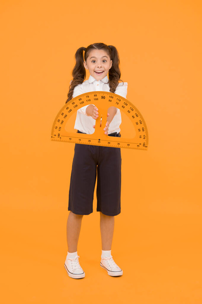 Engineering course. Geometry concept. Schoolgirl holding protractor for lesson. Little child preparing for geometry. Adorable small girl using measuring instrument. Study geometry. Future architect. - Fotoğraf, Görsel