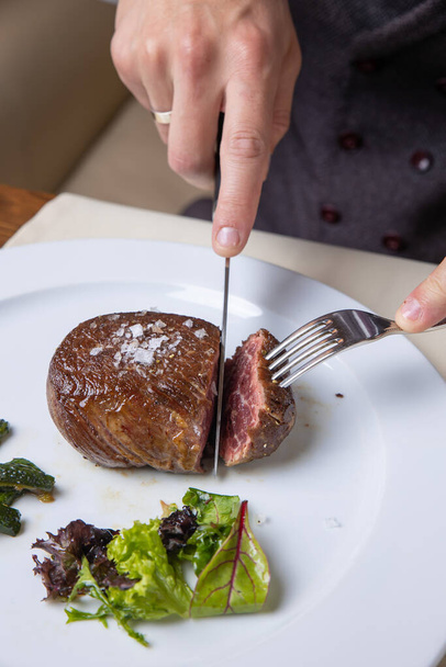 delicious steak from marbled meat in the restaurant - 写真・画像
