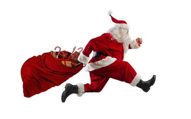 Papai Noel corre rápido para entregar todos os presentes - Foto, Imagem