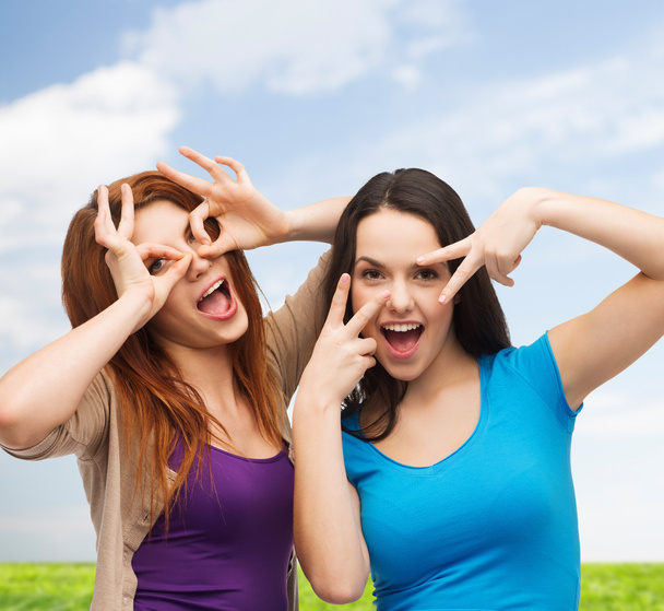 smiling teenage girls having fun - Фото, изображение