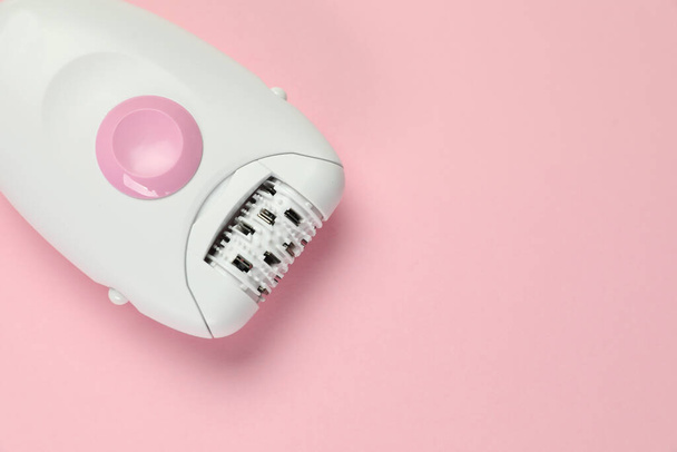 Modern epilator on pink background, top view. Space for text - Фото, изображение