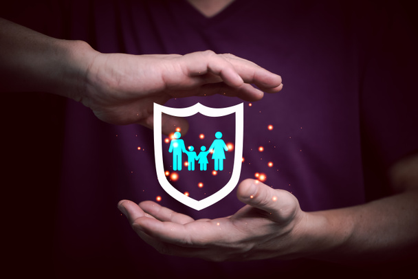 Businessman with protective gesture with family, life, health and house insurance icons, Family life insurance and policy concepts. - Photo, Image