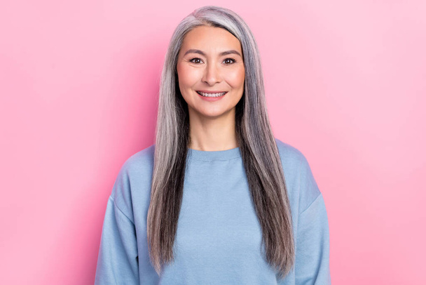 Photo of adorable charming retired woman blue sweater smiling isolated pink color background. - Φωτογραφία, εικόνα