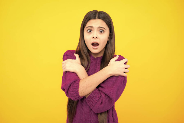 Surprised emotions of young teenager girl. Teenager child girl with shocked facial expression. Surprised face expression, isolated on yellow background. Funny surprise - Photo, image