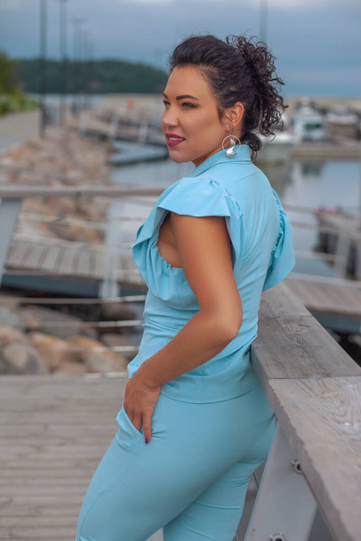young beautiful brunette in a blue suit - Photo, Image