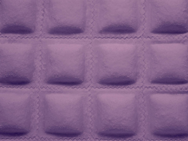 uncooked ravioli background closeup photo, in pink tones - 写真・画像