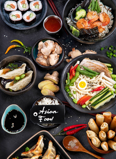 Traditional Asian food. Various of asian meals on dark background. Assorted dishes of traditional cuisine. Top view - Φωτογραφία, εικόνα