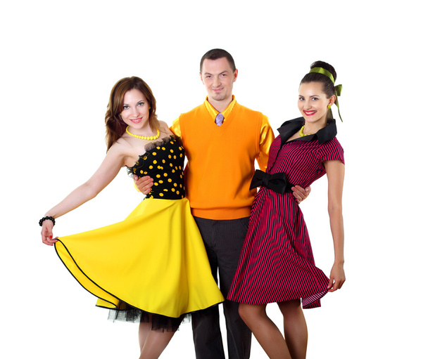 Young man with two women in bright colour wear - Fotoğraf, Görsel
