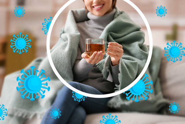 Young woman drinking hot tea at home. Concept of strong immunity - Photo, Image