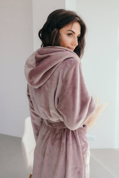 Young healthy serene woman girl relaxing in bathrobe and spa towel after having bath shower at home. Beauty treatment, rest and body care procedures. High quality photo - Zdjęcie, obraz