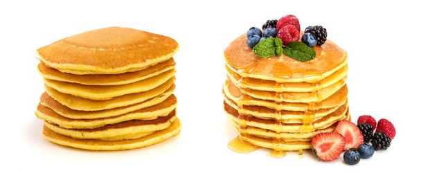 Pancakes stack with different berries and honey isolated on white background. - Photo, Image