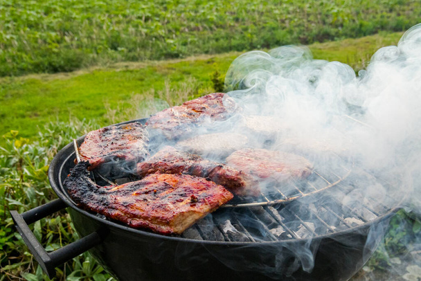 Pork ribs and grilled burgers Delicious.Food background - Photo, image