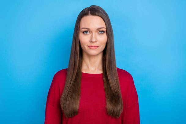 Photo of young sweet brunette lady wear red sweater isolated on blue color background. - Fotoğraf, Görsel