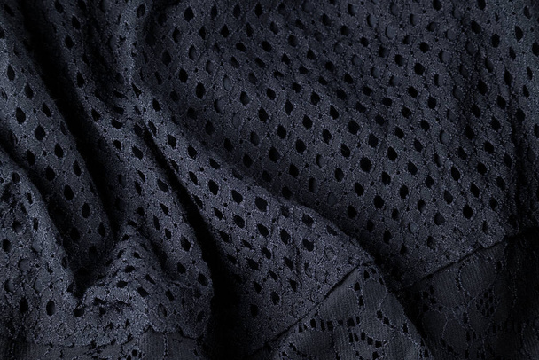 Tissu noir à la mode, ondulé textile moderne vue rapprochée - Photo, image