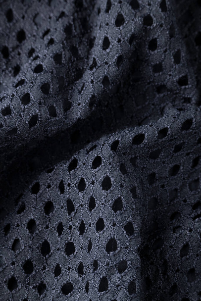 Paño negro de moda, ondulado textil moderno vista de cerca - Foto, Imagen