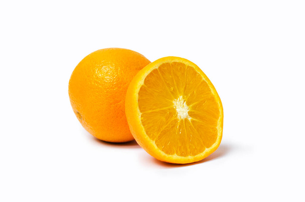 Photo of juicy oranges cut in a half on white background - Fotoğraf, Görsel
