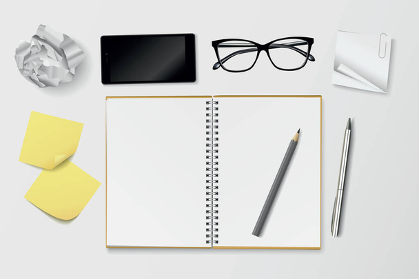 Kreativní pracoviště s otevřeným notebookem, zmačkanou papírovou kuličkou, vyvěšenými poznámkami, brýlemi, telefonem a tužkami shora - vektorová ilustrace - Vektor, obrázek
