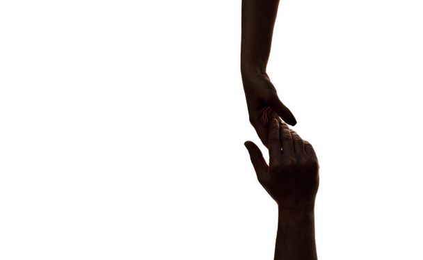 Mercy, dwie ręce sylwetka, połączenie lub koncepcja pomocy. Pojęcie relacji międzyludzkich, wspólnoty, symbolizmu wspólnoty - Zdjęcie, obraz