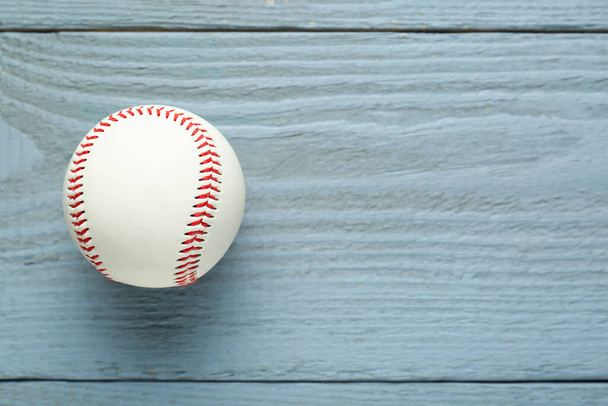 Baseball ball on grey wooden table, top view. Space for text - Foto, Imagen