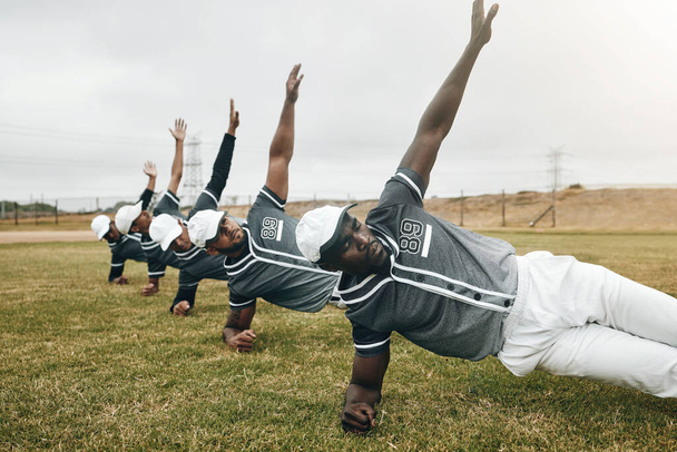 Sports, baseball field and team doing body stretching to prepare for game, competition or fitness workout. Sport, focus or exercise training group of people, athlete or warm up with winner mindset. - Photo, image