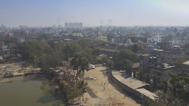 View from top, Howrah city, West Bengal, India. Howrah is a 500 year old city, older than Kolkata which is 300 years old city. - Fotó, kép