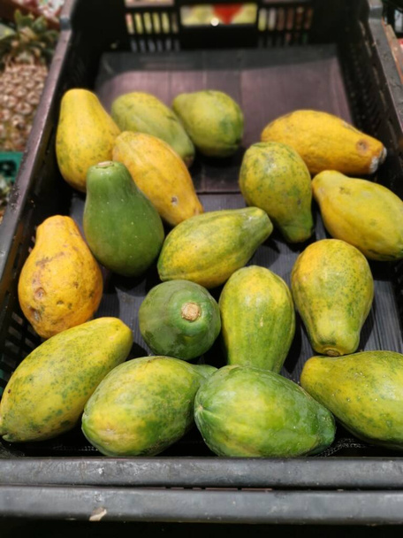 muchos frutos de papaya enana. - Foto, Imagen